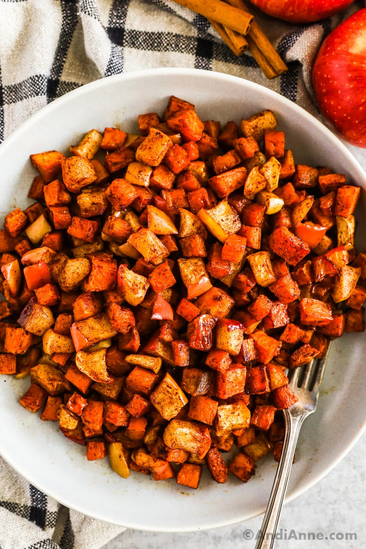 A bowl of roasted cinnamon apple sweet potato.