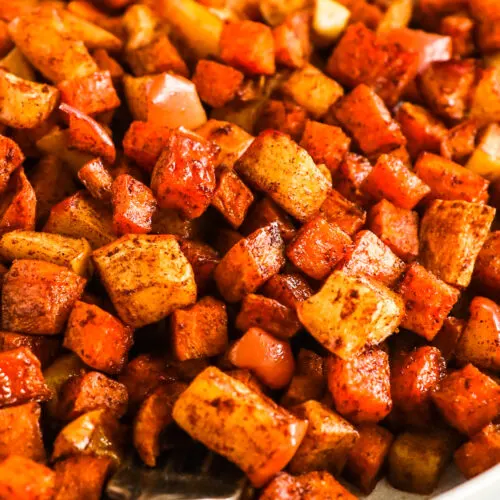 A plate of cinnamon roasted sweet potatoes and apples.