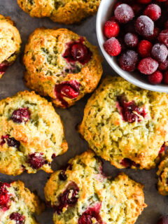 Cranberry scones with a bowl of frozen cranberries