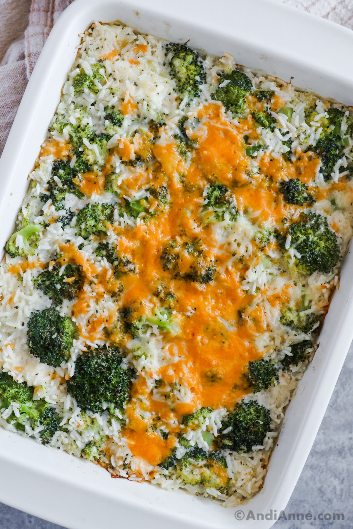 Broccoli rice cheese casserole recipe in a white dish.