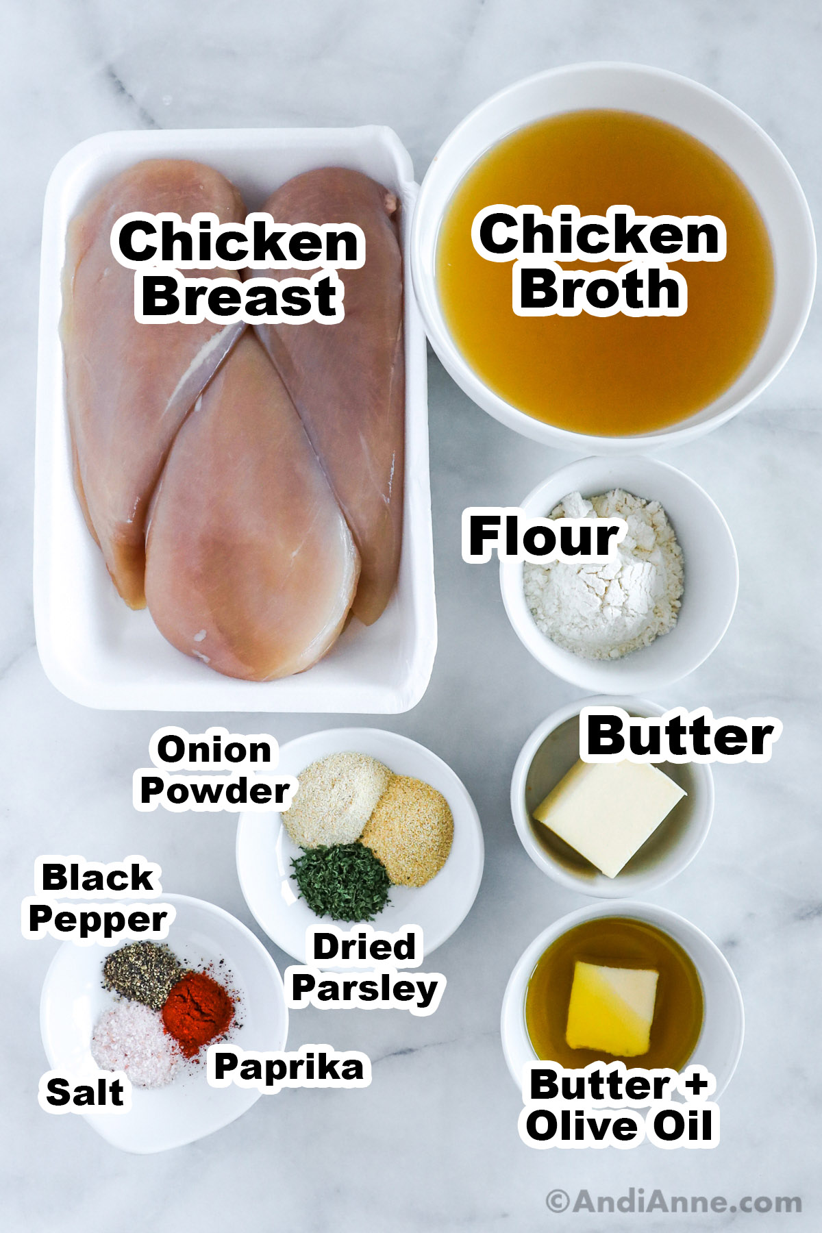Recipe ingredients in bowls including chicken broth, chicken breast, flour, butter, oil and spices.