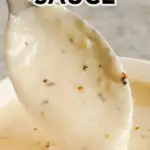 spoon pouring garlic parmesan sauce into bowl