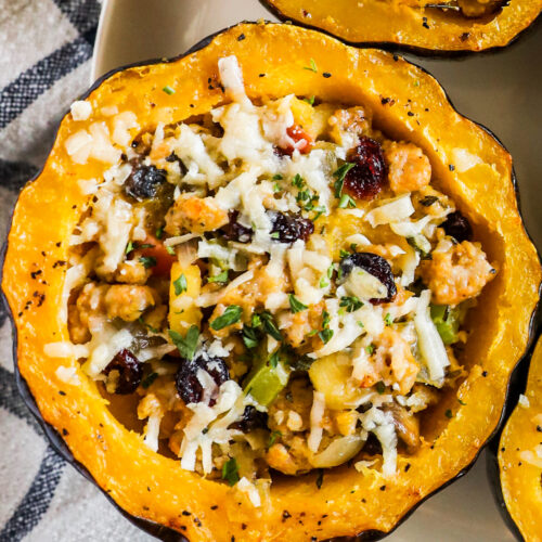 Stuffed acorn squash with ground beef, vegetables and topped with parmesan.