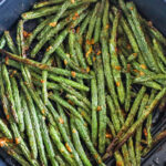 A basket of air fryer green beans