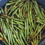 A basket of air fryer green beans