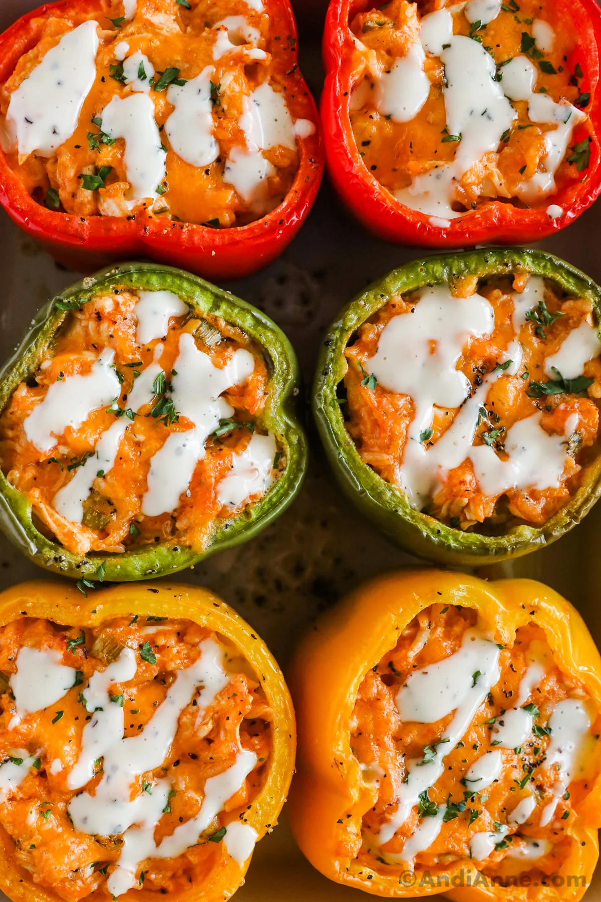 Six roasted bell peppers stuffed with buffalo chicken and drizzled with ranch dressing.