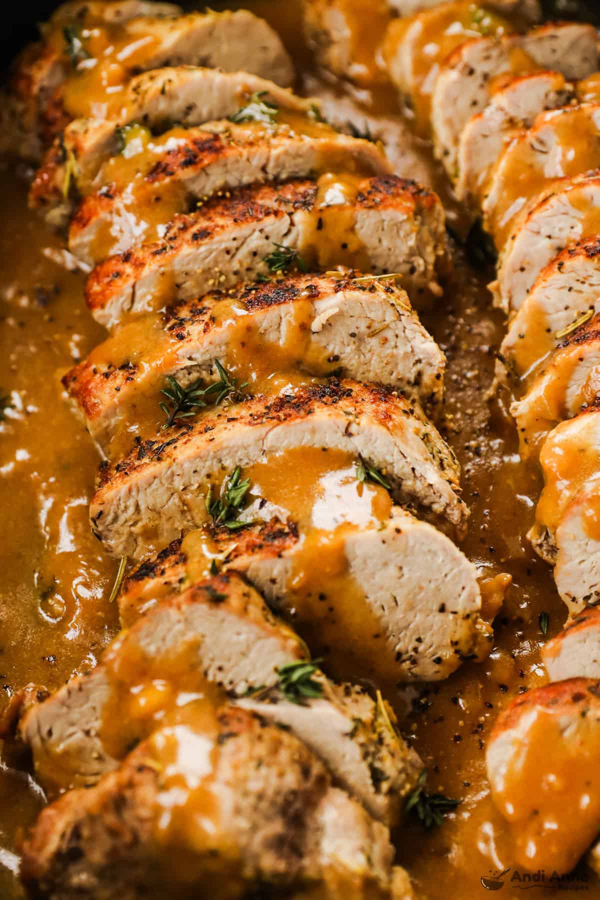 Slices of pork tenderloin in a pan gravy.
