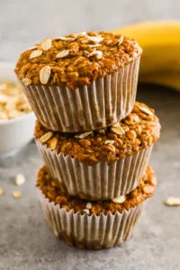 Stack of banana oatmeal muffins on top of eachother