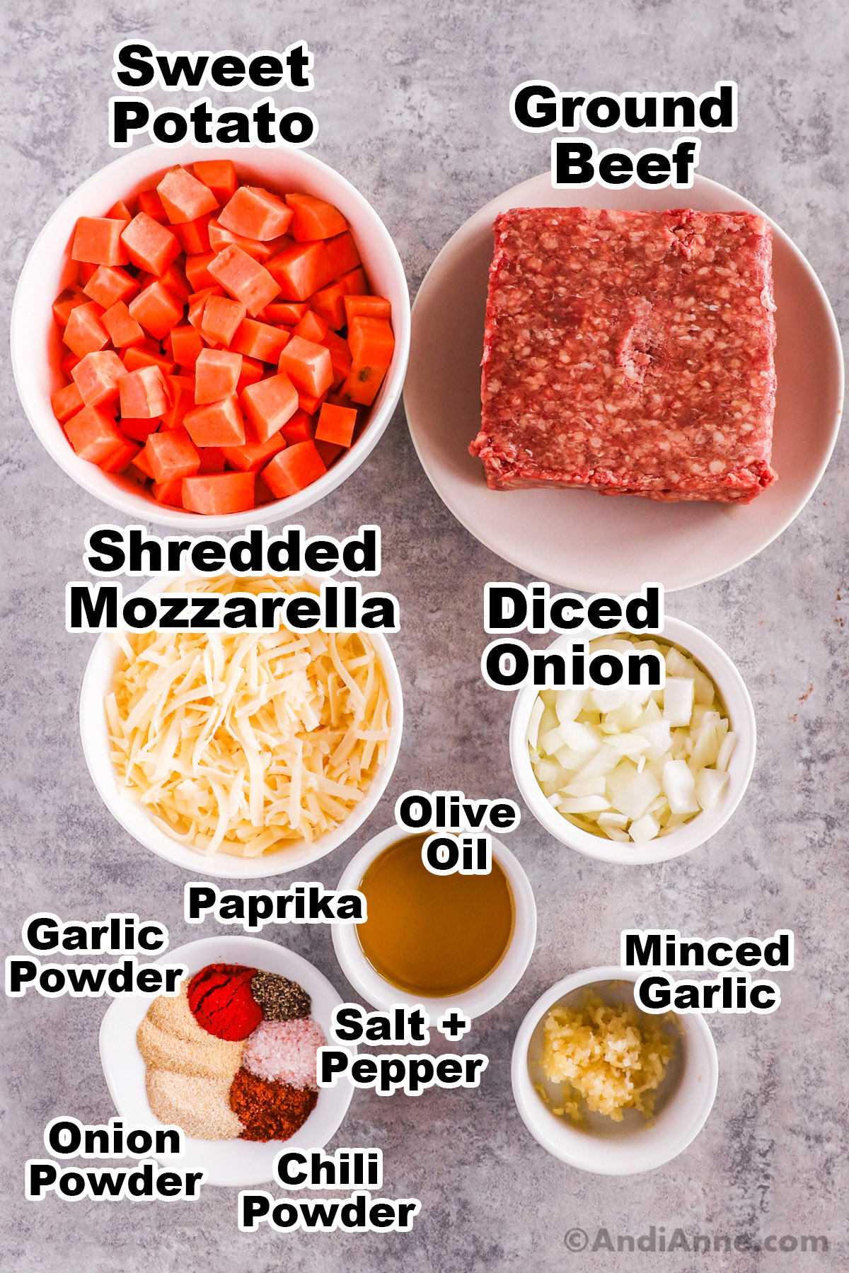 Recipe ingredients including chopped sweet potato, raw ground beef, shredded mozzarella cheese, diced onion, olive oil, minced garlic and spices.