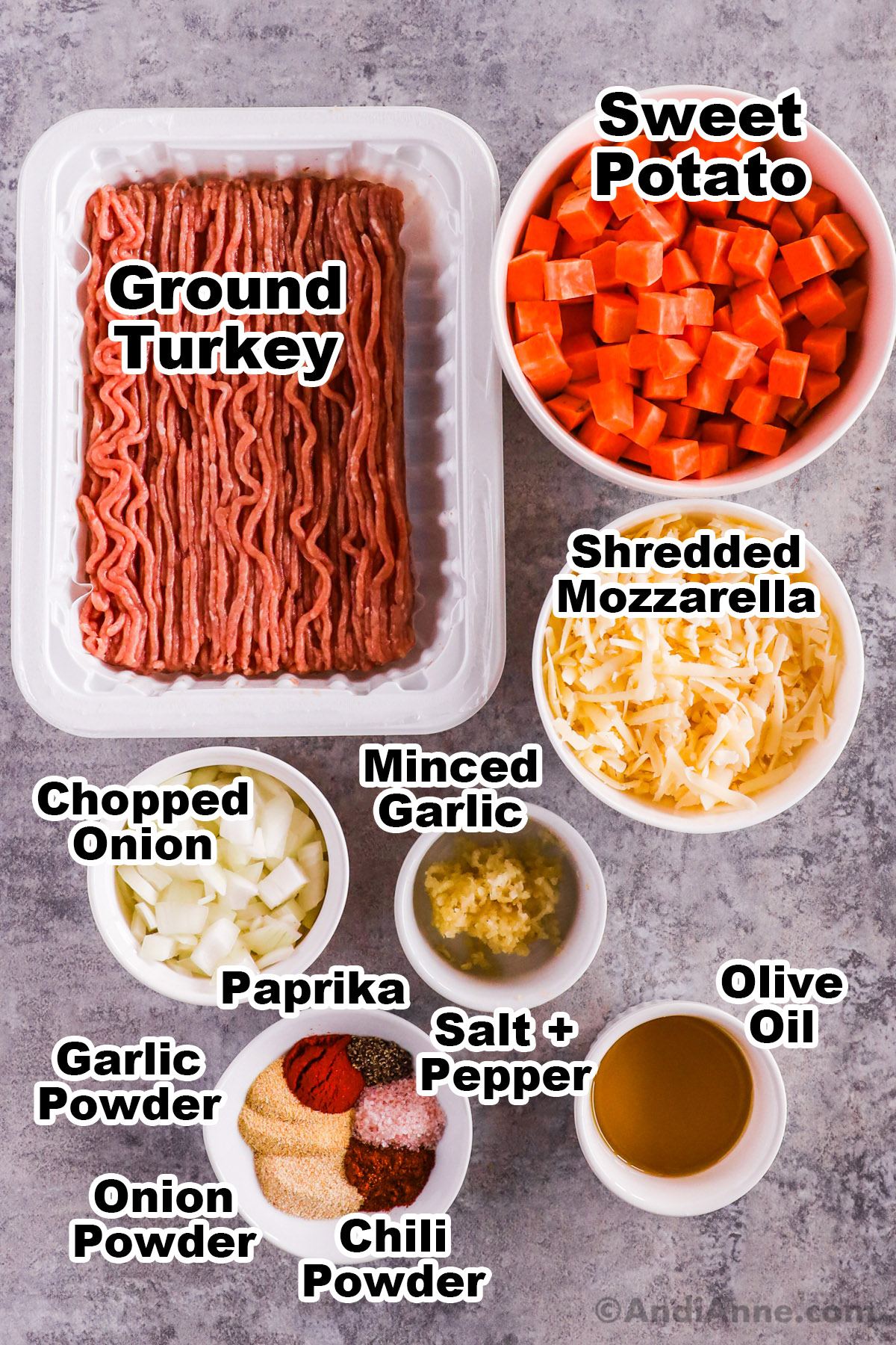Recipe ingredients including raw ground turkey, chopped sweet potato, shredded mozzarella, chopped onion, minced garlic, olive oil and spices.