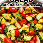 A bowl of healthy tomato cucumber salad with balsamic dressing