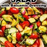 A bowl of healthy tomato cucumber salad with balsamic dressing