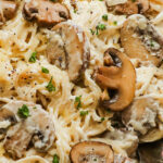 Close up of a fork with creamy mushroom pasta