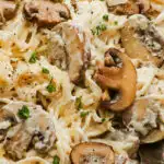 Close up of a fork with creamy mushroom pasta