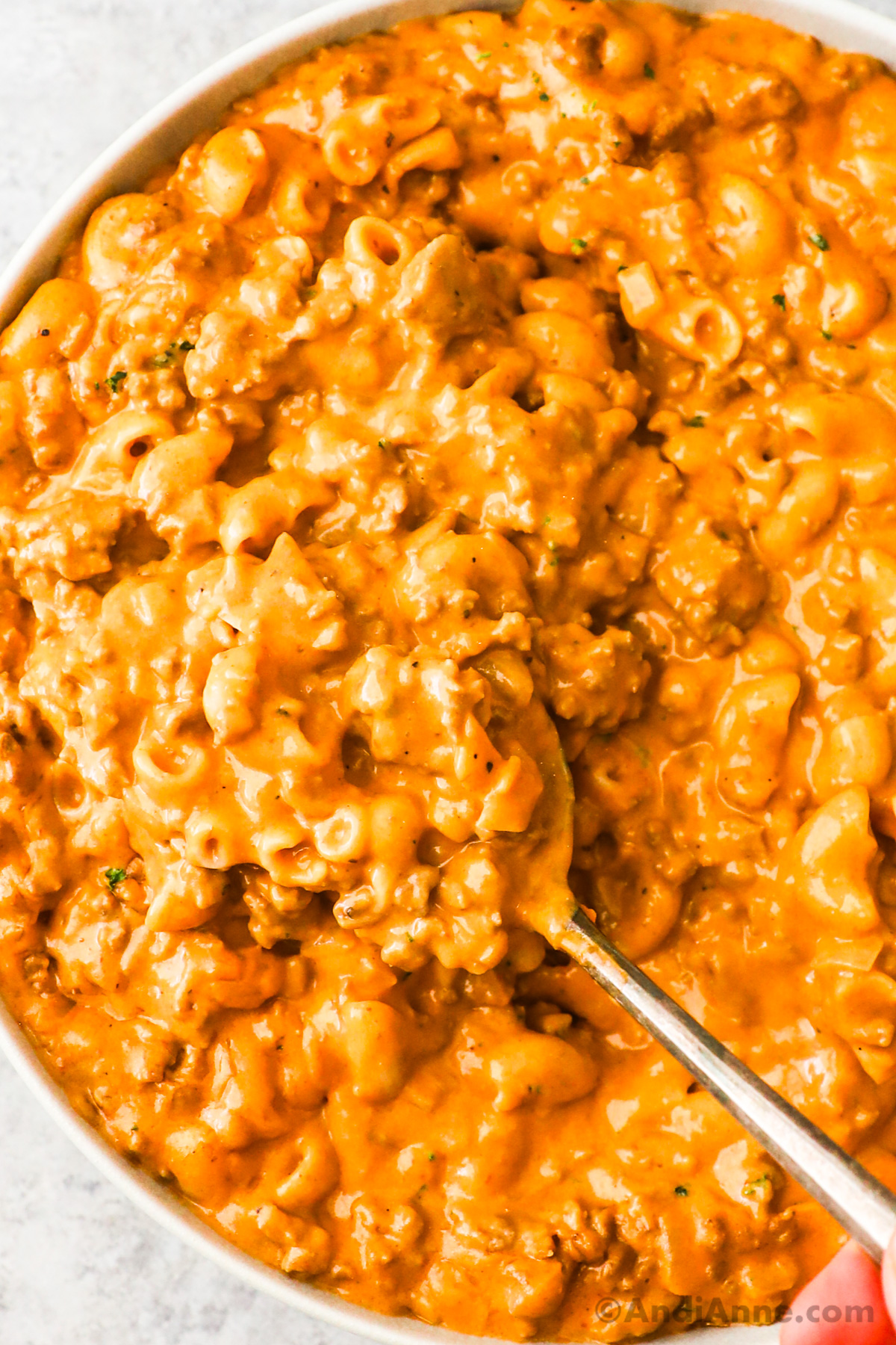 Close up of cooked hamburger casserole recipe with a spoon