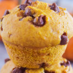 close up of 2 pumpkin chocolate chip muffins