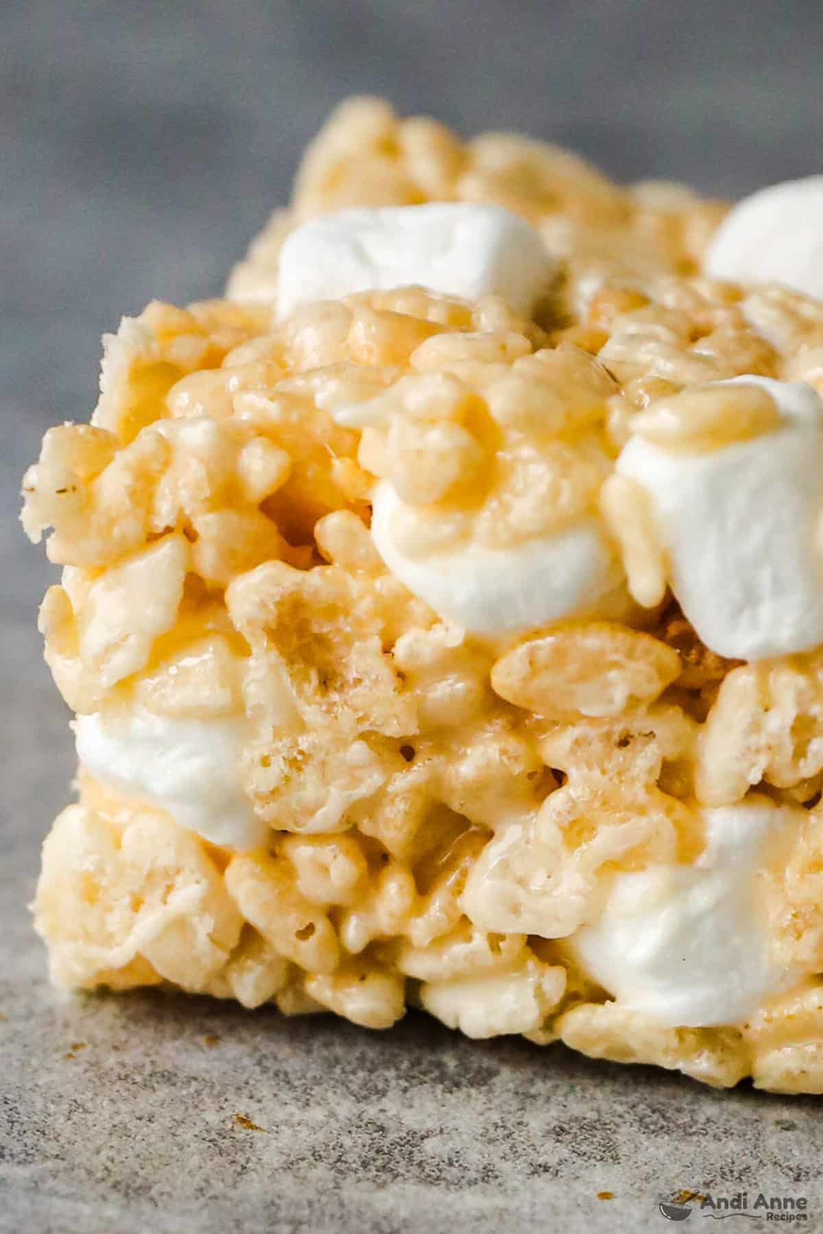 Close up of a rice krispie square with extra marshmallows