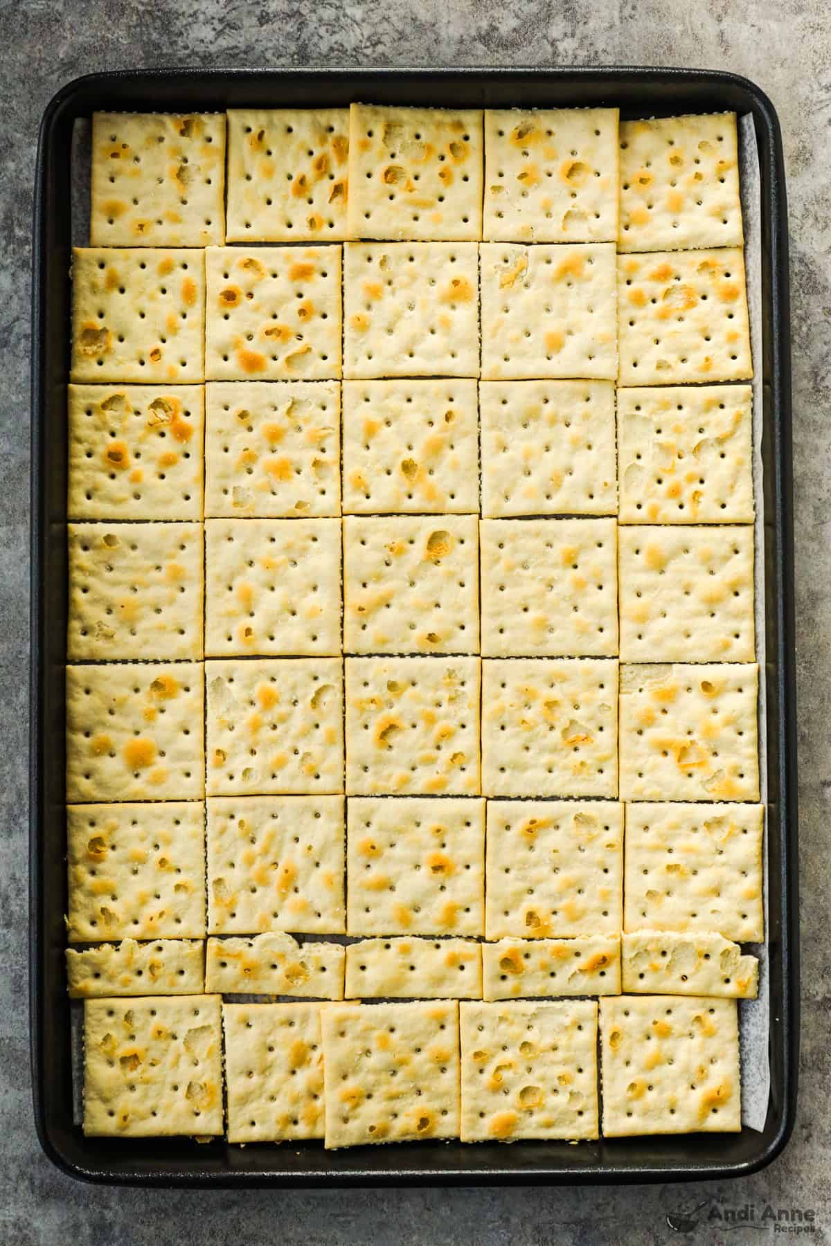 Baking sheet with saltine crackers on it