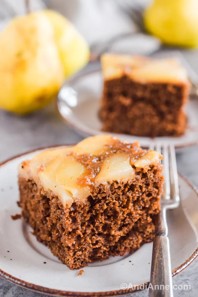 Slices of pear gingerbread cake with pears in background