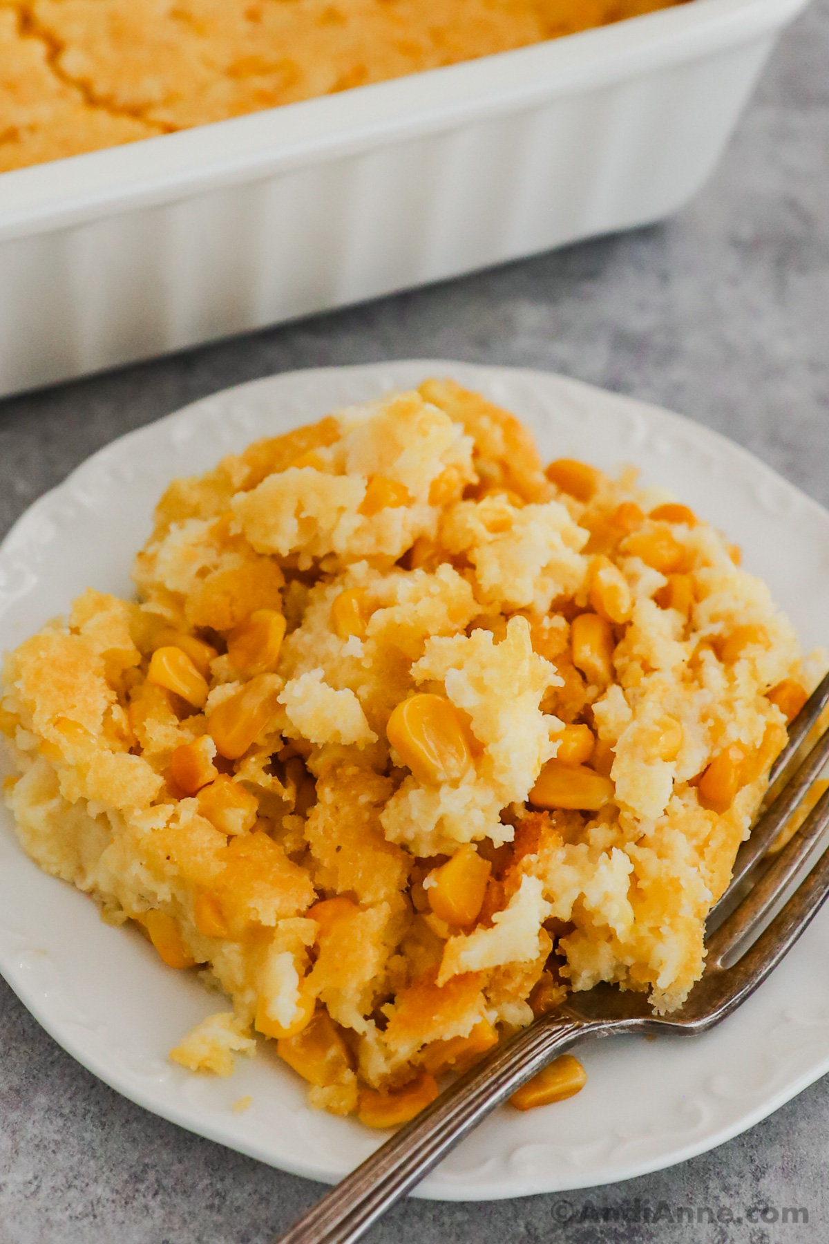 Plate of jiffy corn casserole with a fork