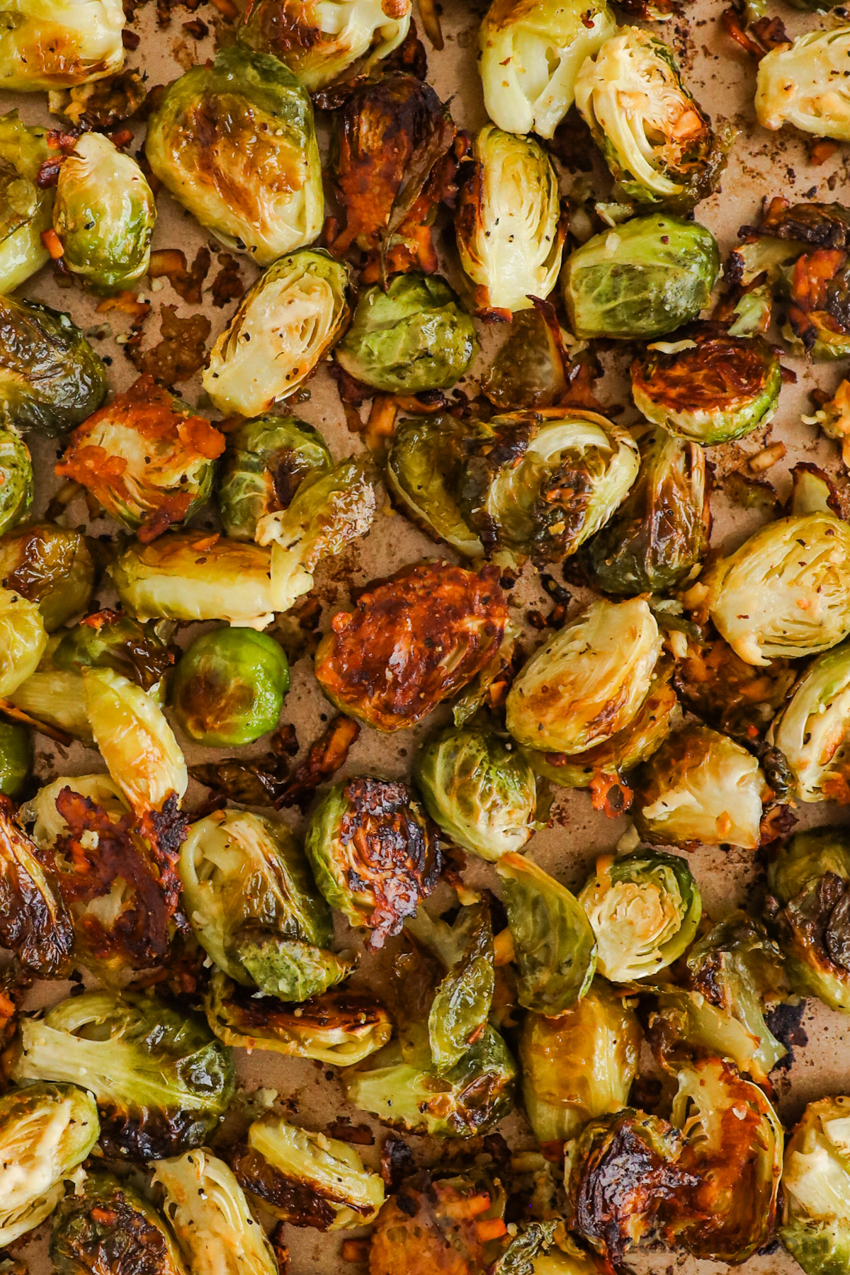 Close up of crispy brussels sprouts on a baking sheet