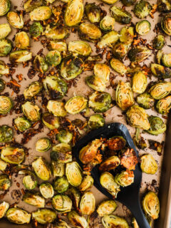 baking sheet with spatula and roasted brussels sprouts