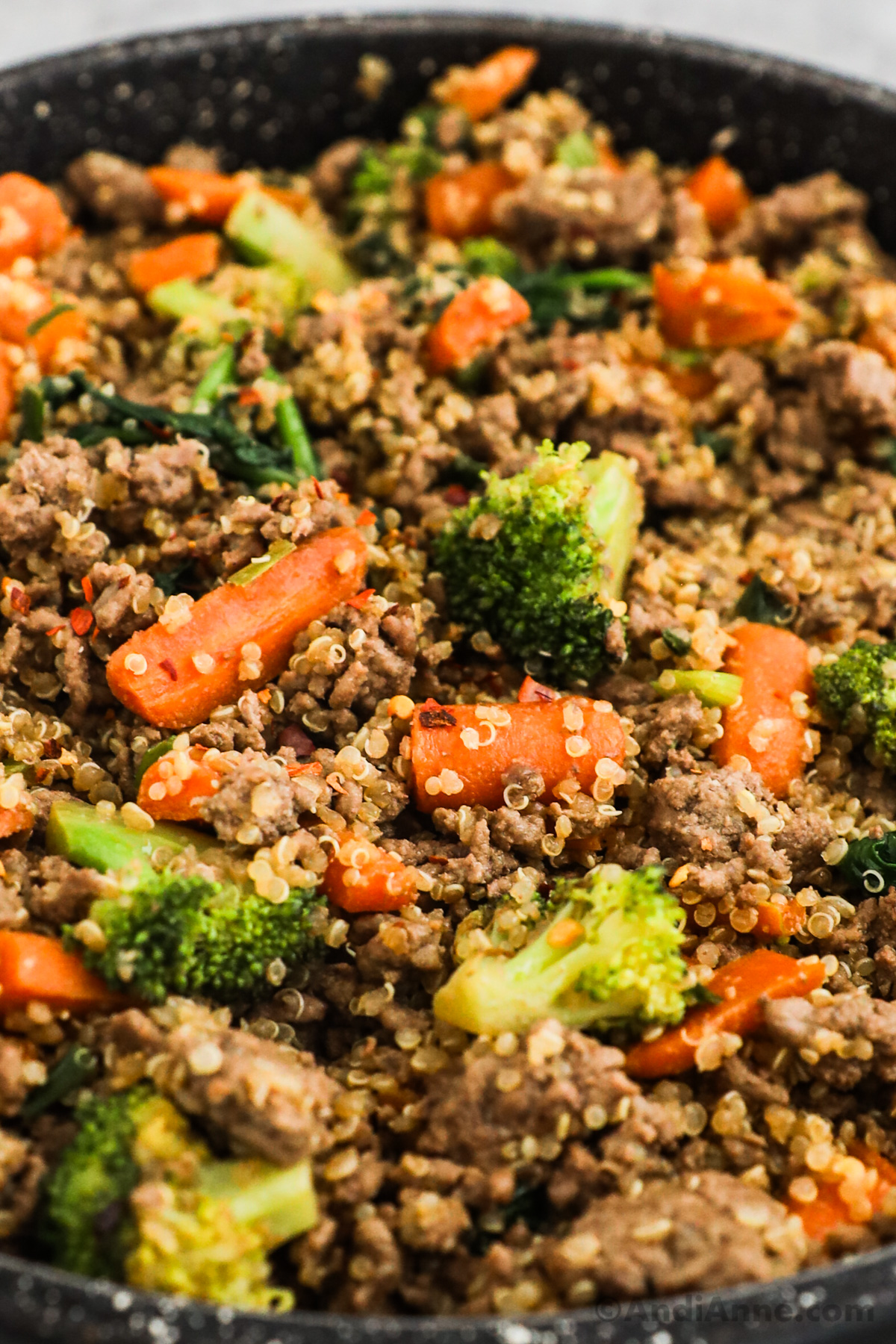 Close up of broccoli and carrots in a quinoa beef stir fry