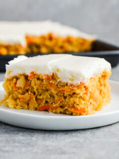 Slice of carrot cake on a plate.