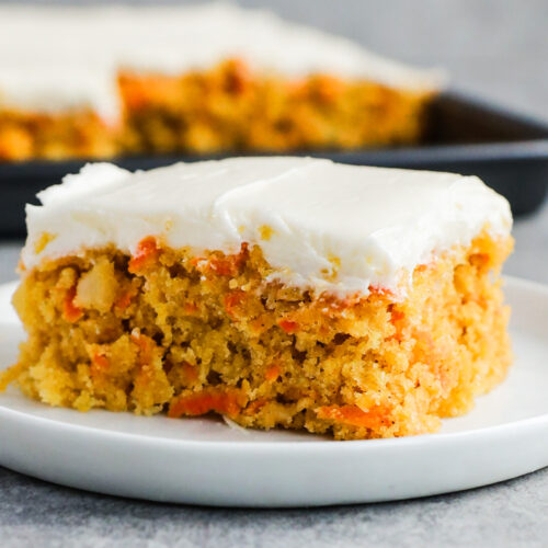 Slice of carrot cake on a plate.