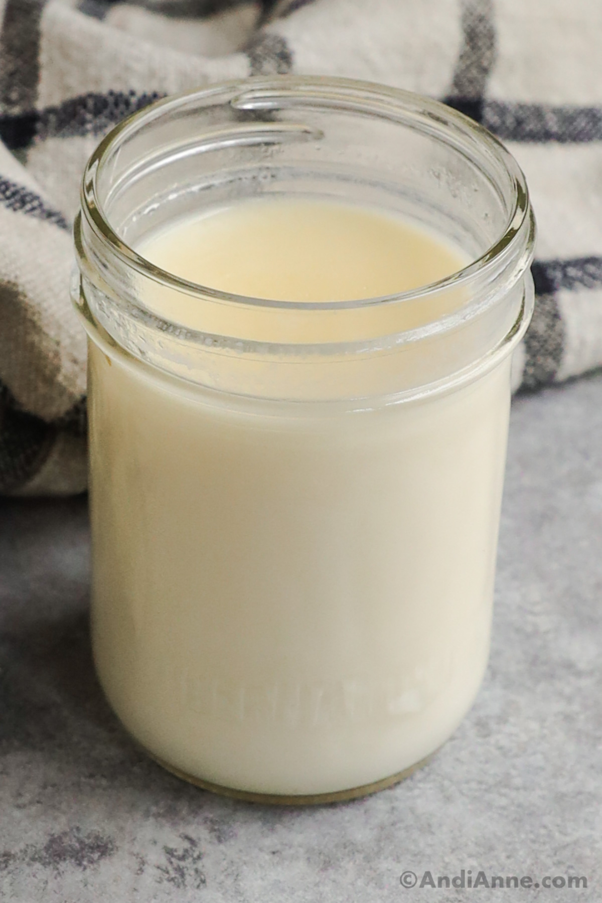 A jar of white homemade heavy cream