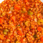 a bowl of healthy lentil soup with a spoon