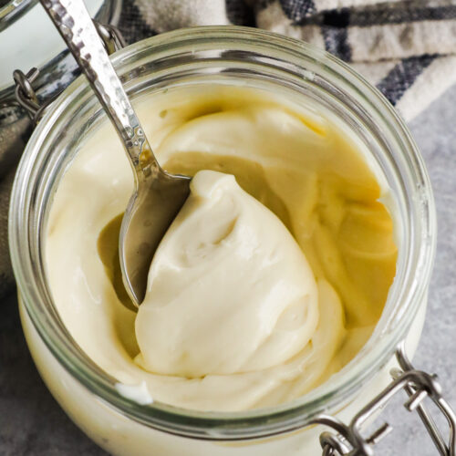 a jar of homemade mayonnaise with a spoon