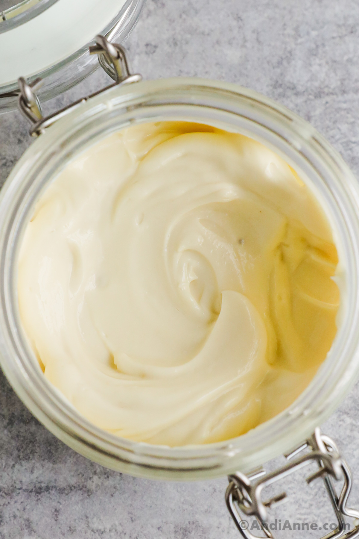 Close up of homemade mayonnaise in a jar.