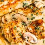 Close up of creamy mushroom chicken in a skillet