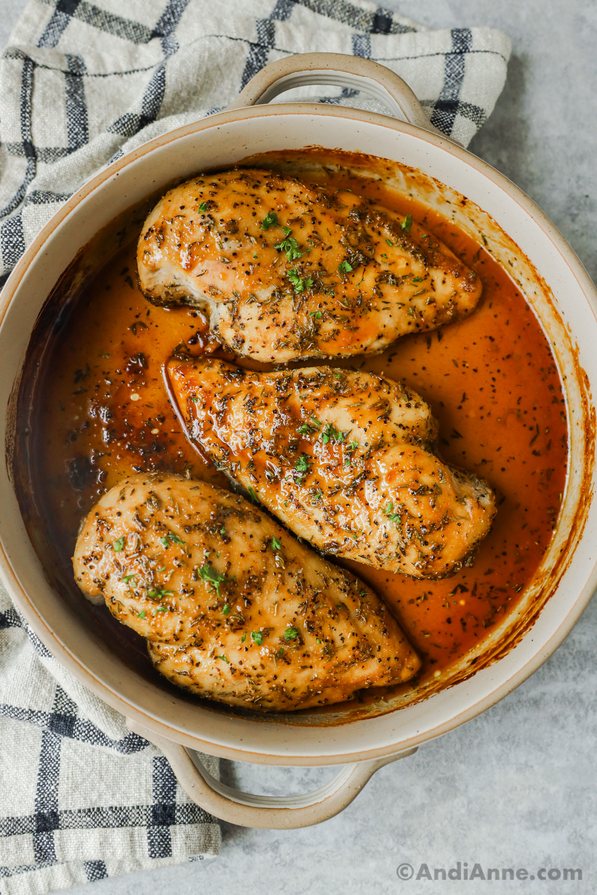 Close up of cooked brown sugar chicken breasts in a baking dish.