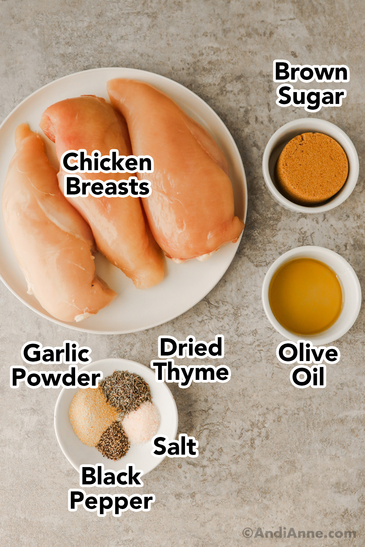 A plate with raw chicken breasts, and small bowls with brown sugar, olive oil, and a small plate with spices