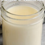 A jar of easy homemade heavy cream with only 2 ingredients needed