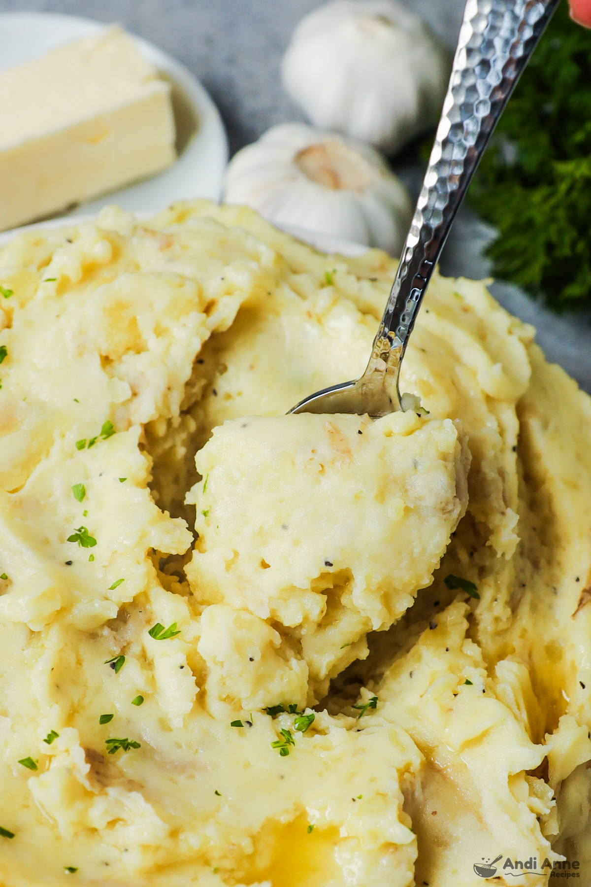 A spoon scooping some mashed potatoes