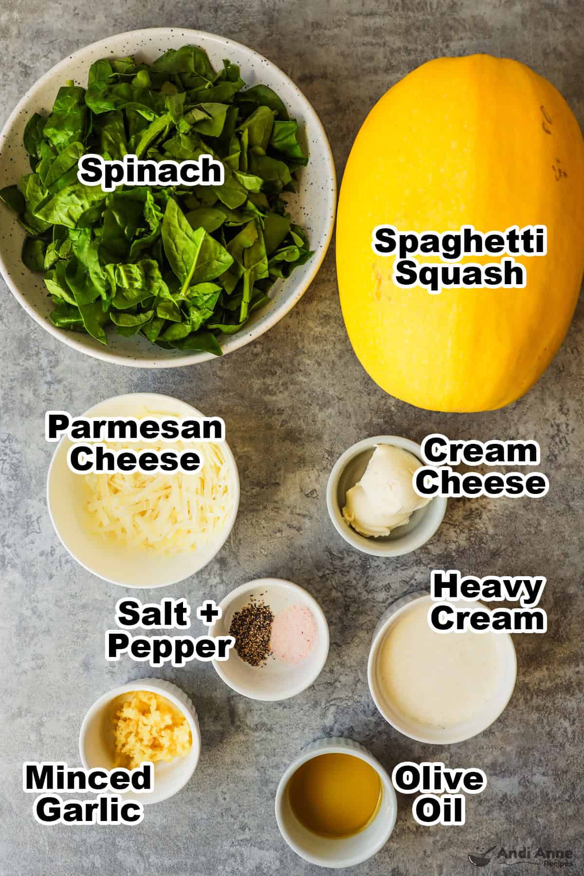 Bowl of spinach, spaghetti squash, and bowls of grated parmesan cheese, cream cheese, heavy cream, minced garlic, olive oil. 