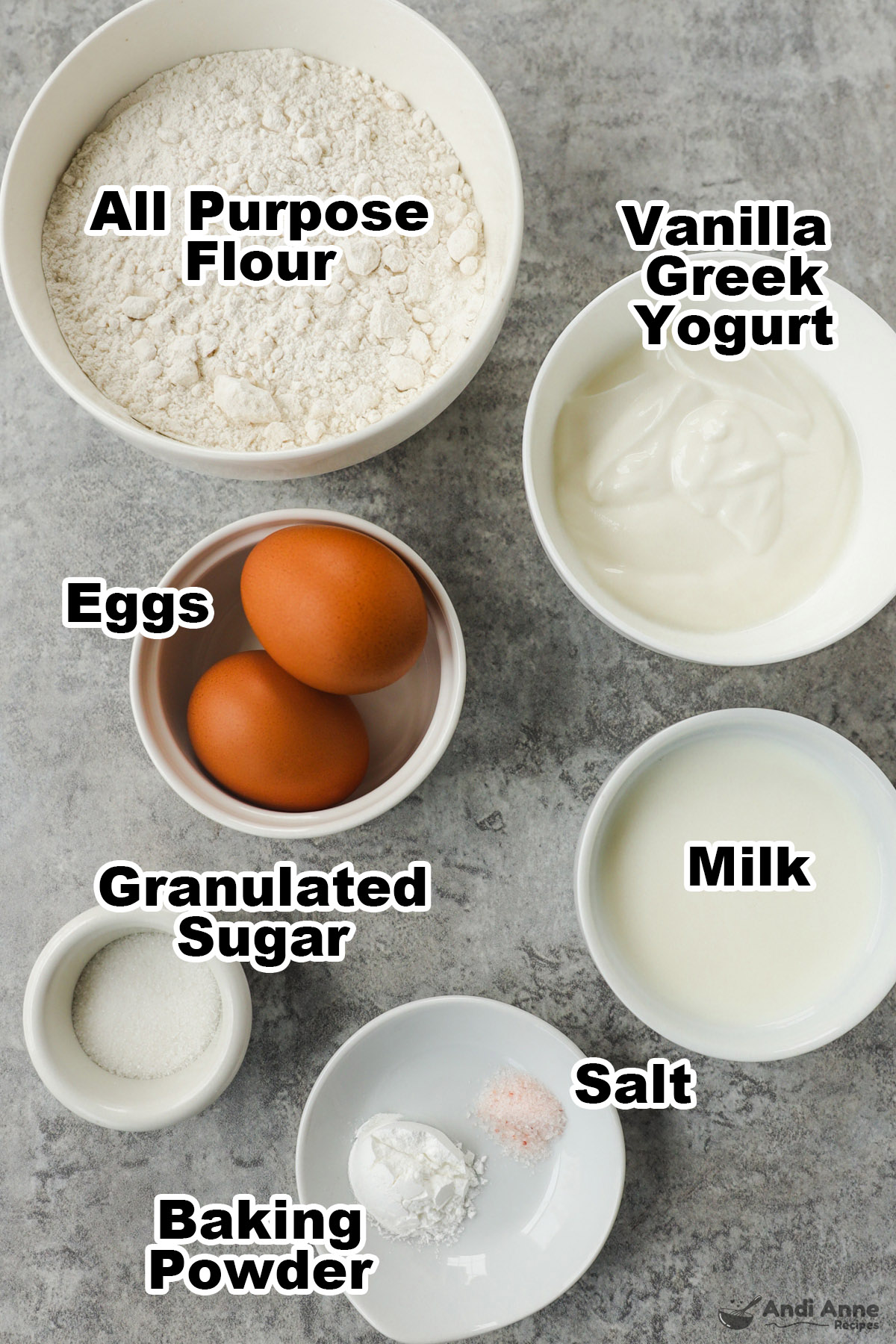 Bowls of flour, yogurt, eggs, milk, sugar, salt and baking powder.