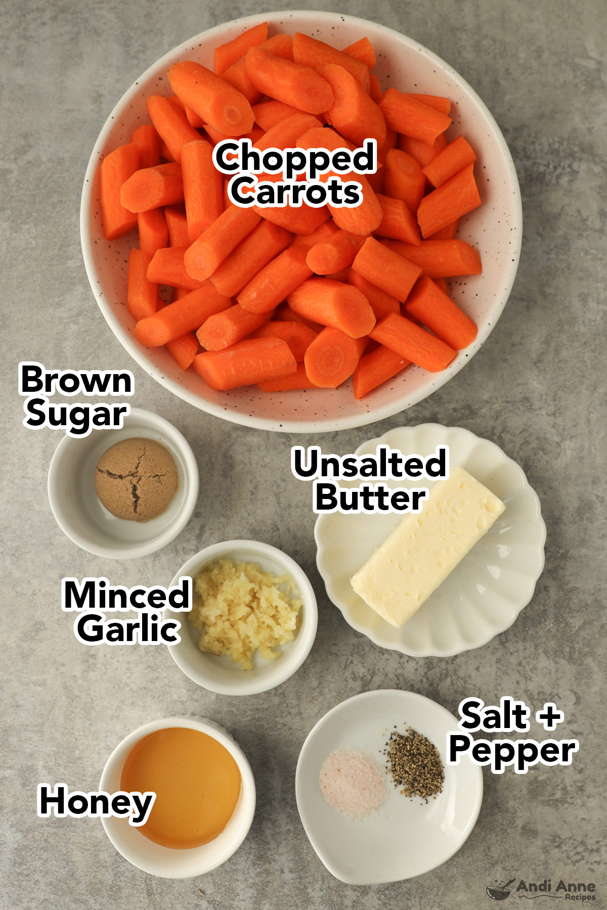 Recipe ingredients in bowls including chopped carrots, butter, brown sugar, minced garlic, salt and pepper, and honey