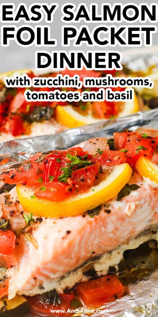 Close up of easy salmon foil packed dinner with zucchini, mushrooms, tomatoes and basil