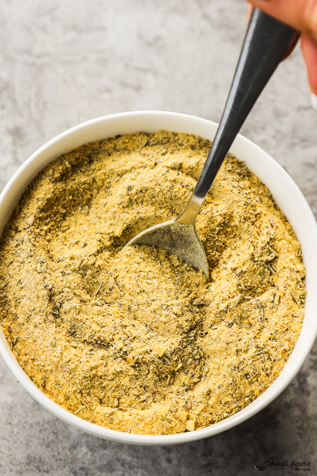 Spoon in a bowl with chicken bouillon powder 