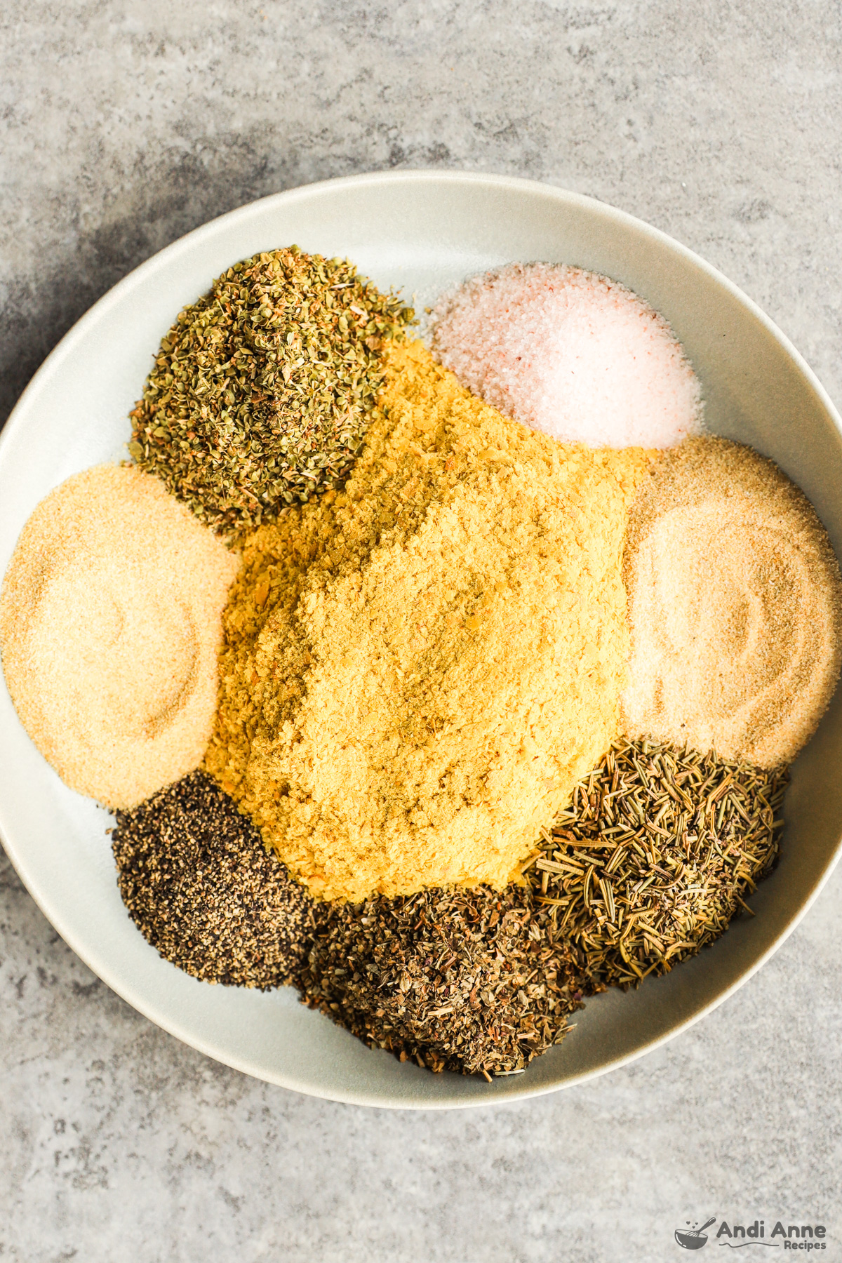 A plate with different spices organized into little piles