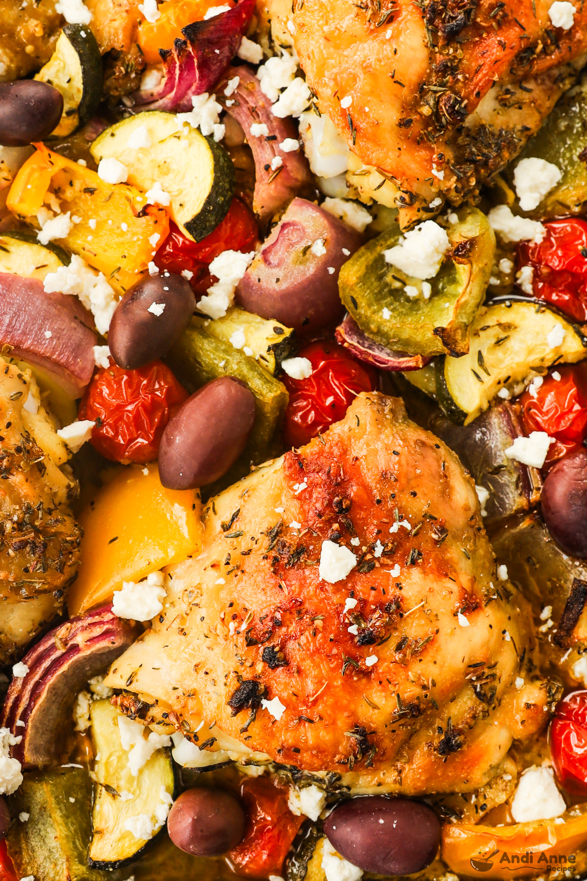 Close up of greek chicken thighs and veggies