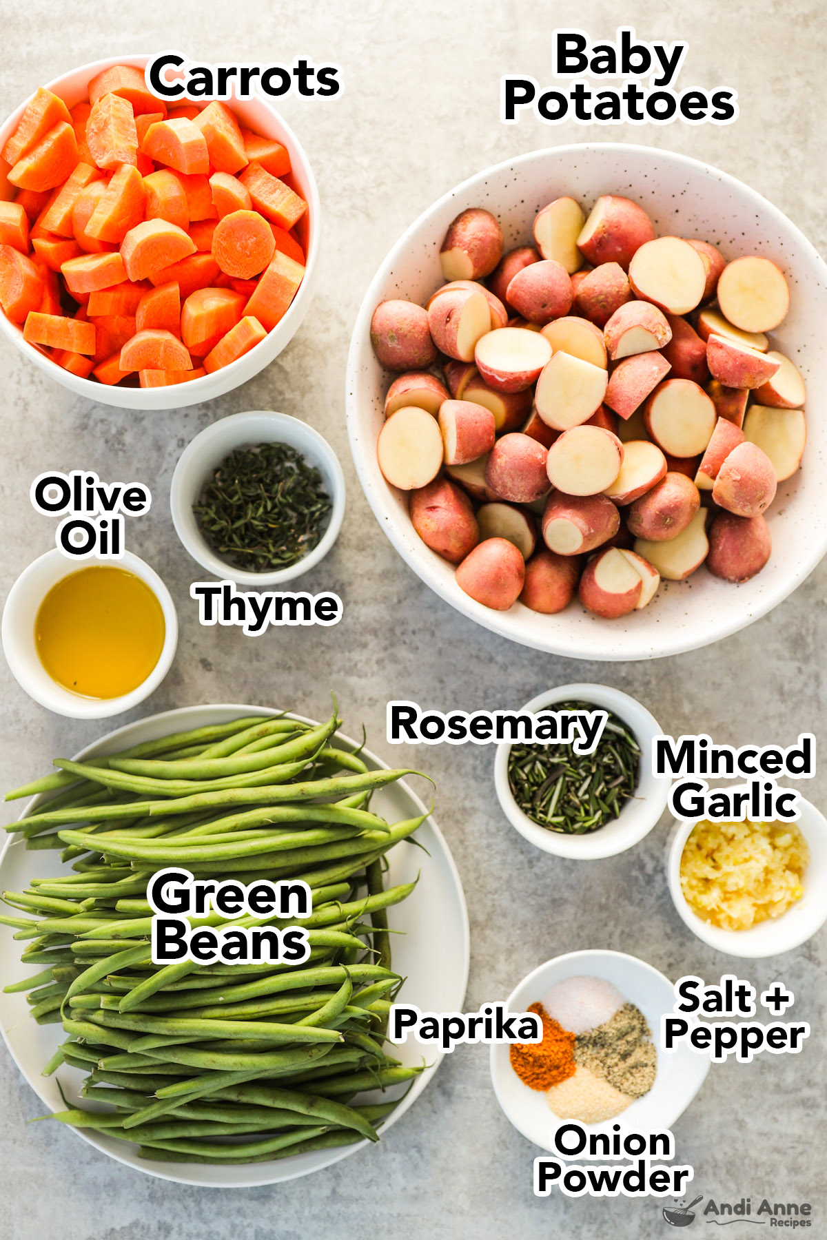 Recipe ingredients in bowls including chopped carrots, baby red potatoes, green beans, thyme, olive oil, rosemary, minced garlic and spices.