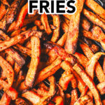 close up of crispy sweet potato fries in an air fryer basket