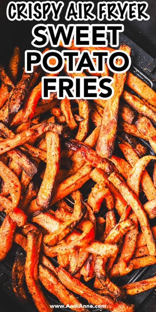 close up of crispy sweet potato fries in an air fryer basket