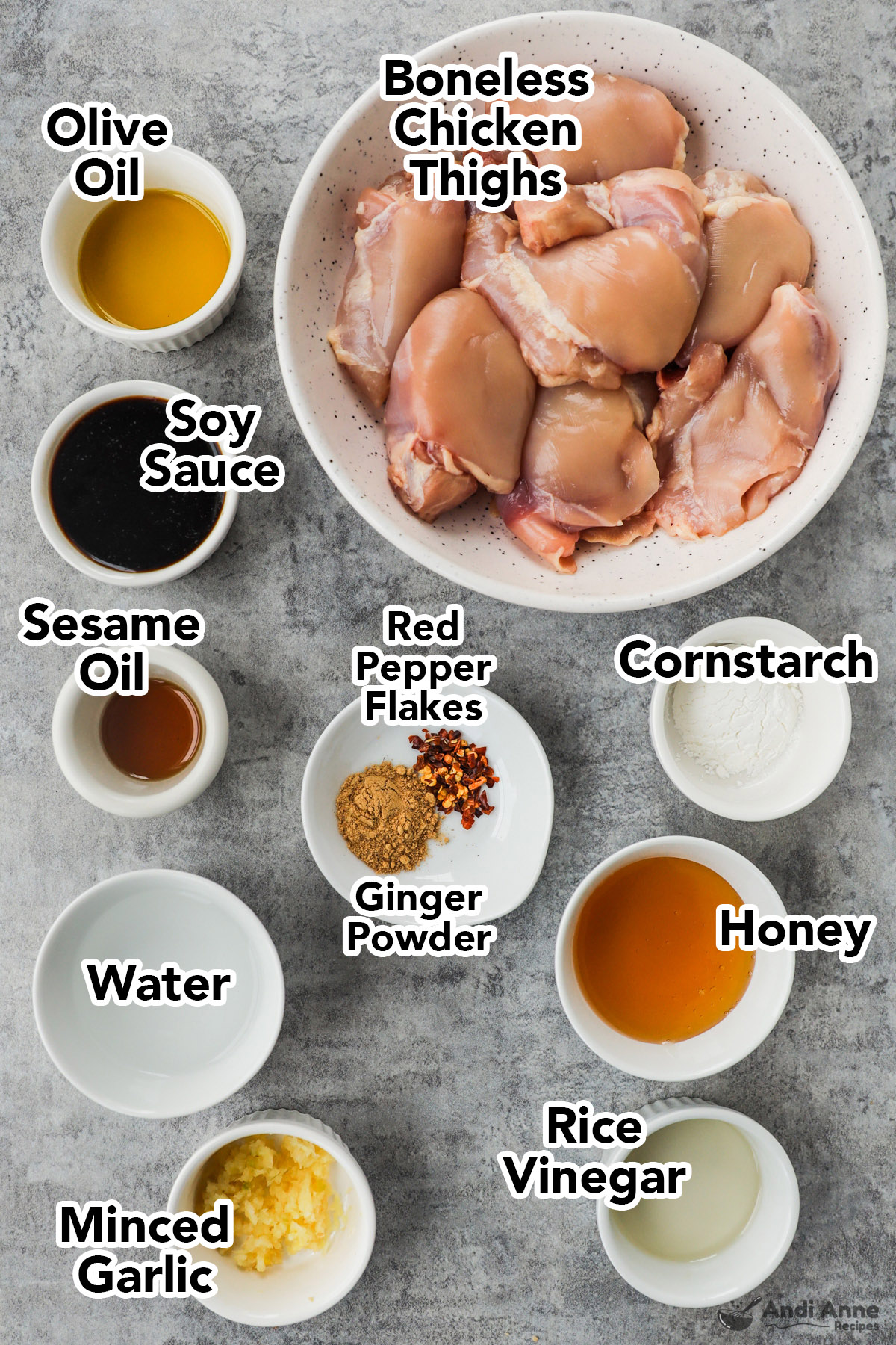 Bowls of ingredients including olive oil, soy sauce, boneless chicken thighs, sesame oil, honey, cornstarch, spices, rice vinegar and minced garlic