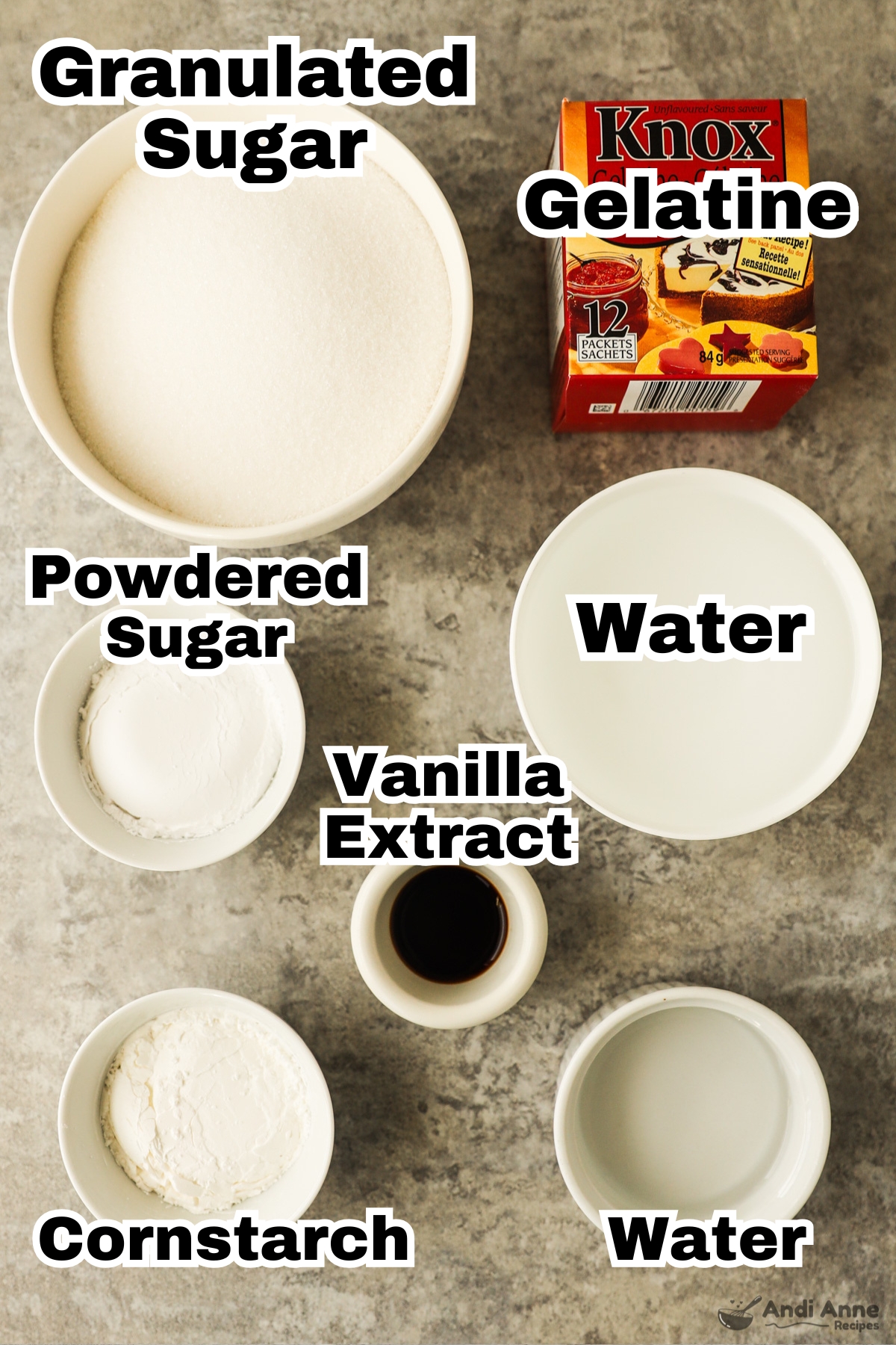 Recipe ingredient in bowls including granulated sugar, gelatin, powdered sugar, water, vanilla extract, cornstarch and water